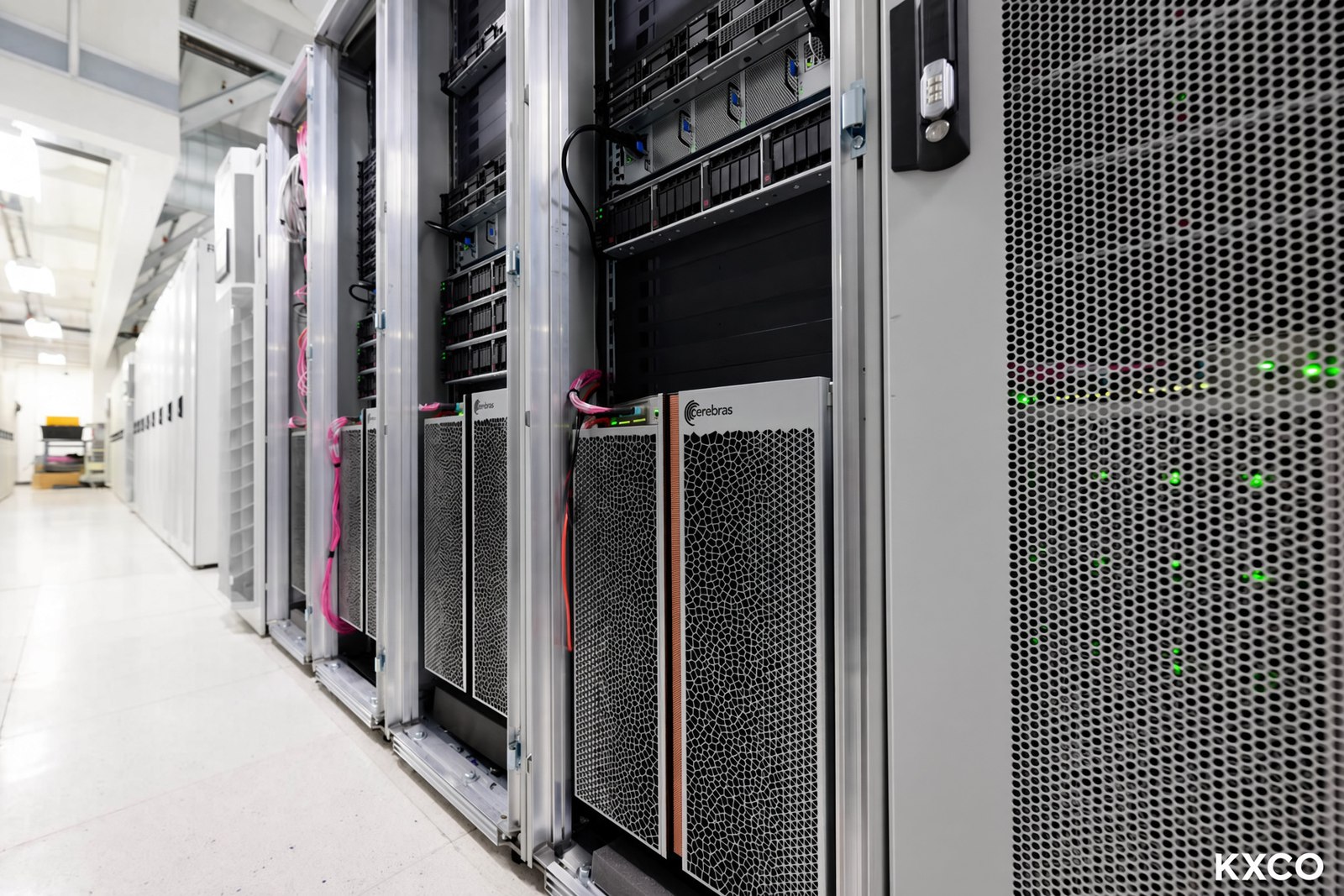 A row of Cerebras CS-3 systems installed in a production data centre with integrated liquid cooling
