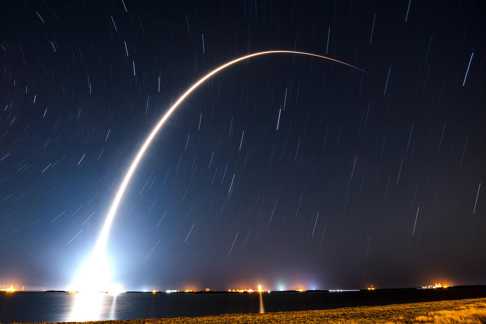 SpaceX rocket launching at night